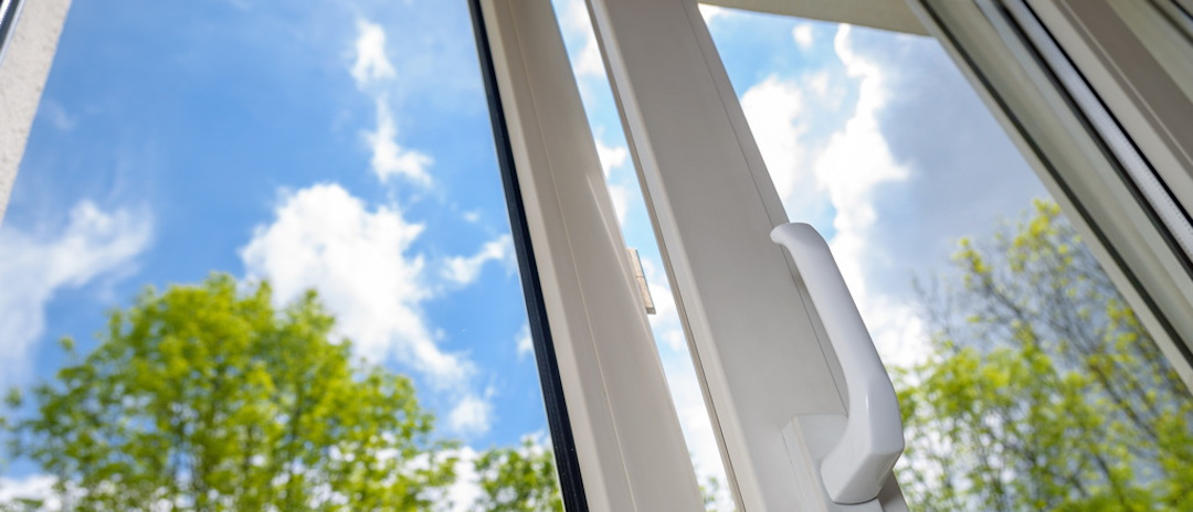 View through an open window to the sky outside