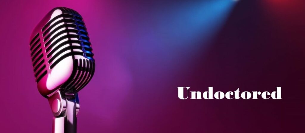 Image of microphone in front of a coloured background, with the word Undoctored